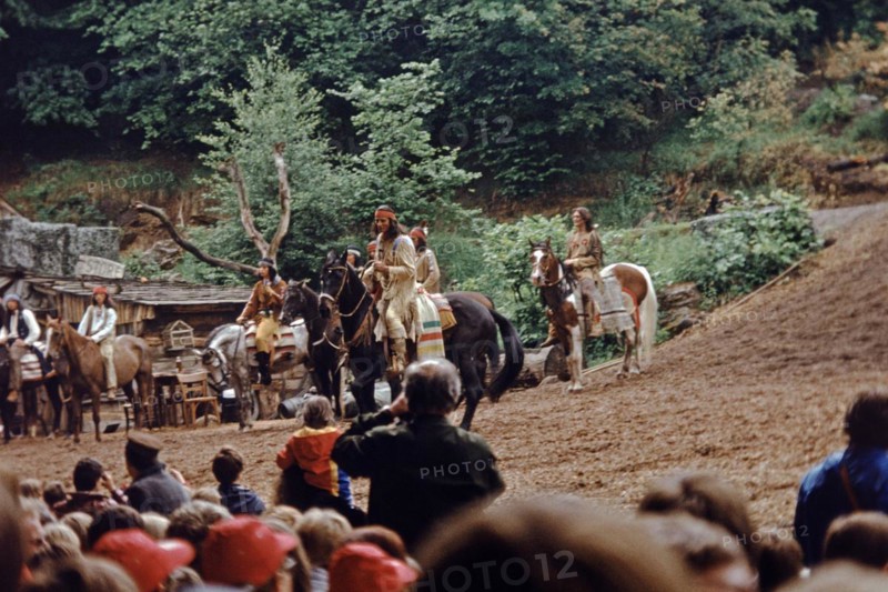 Pierre Brice as Winnetou and other actors riding horses in The Treasure in Silver Lake, Karl May Festival, open-air theatre Elspe, Sauerland, North Rhine-Westphalia, Germany, June 1982, vintage, retro, old, historical, Europe