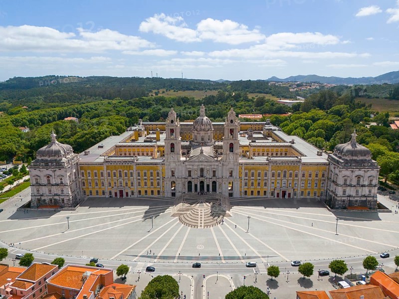 Aerial view of a baroque palace with symmetrical design, surrounded by a green landscape and square, Aerial view, Palace, Palácio Nacional de Mafra, Lisbon, Lisboa, Portugal, Europe