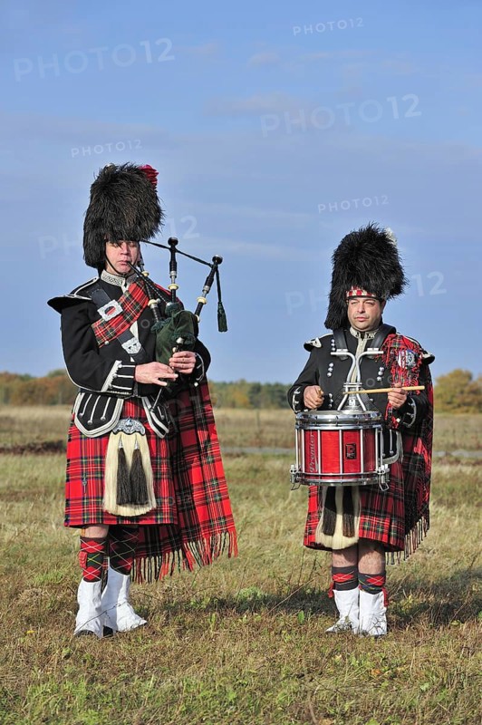 Scottish bagpipers playing pipes and drums, Scotland, UK