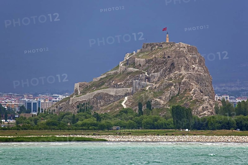 The Fortress of Van, Van Citadel, Van Kalesi on the shores of Lake Van during thunderstorm, Turkey, Asia