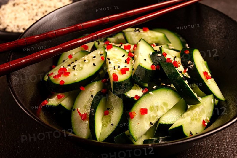 Chinese salad, cucumbers with chili pepper and sesame seeds, homemade, no people