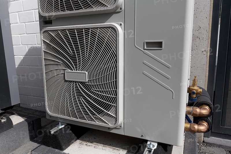 Outdoor units of a heat pump in front of a newly built two-family house, heating and air conditioning, Düsseldorf, North Rhine-Westphalia, Germany, Europe