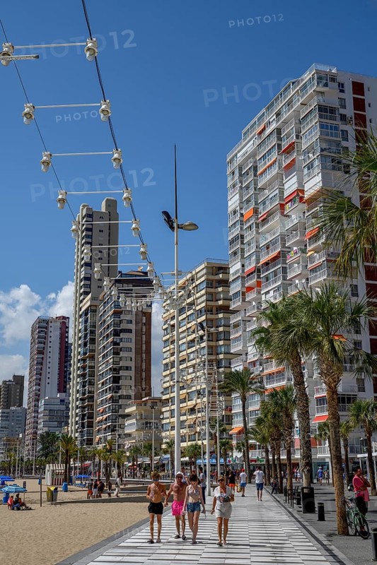 Tourists on the beach promenade at Playa Levante, Benidorm, Alicante province, Costa Blanca, Spain, Europe