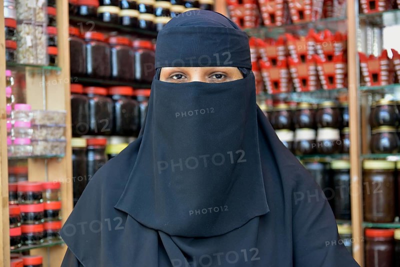 Portrait of a incense seller at her booth on the incense market, Salalah, Dhofar Region, Orient, Oman, Asia