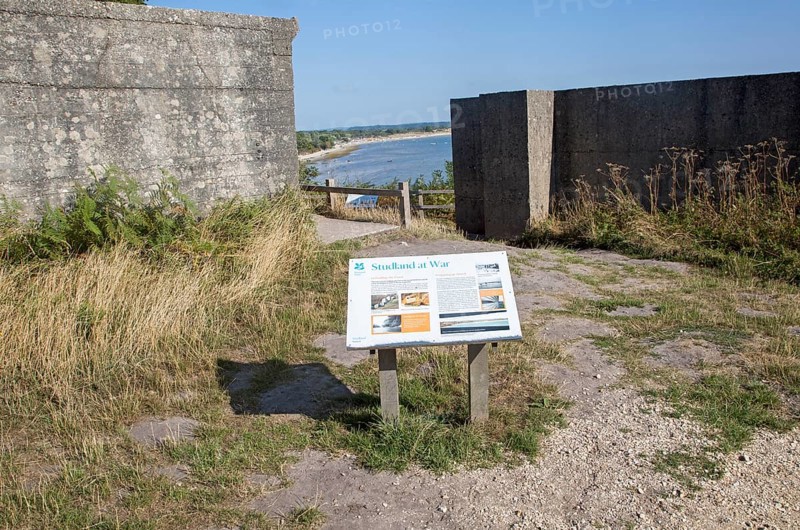 Second world war information panel by defensive structures at Fort Henry, Studland Bay, Swanage, Dorset, England, UK