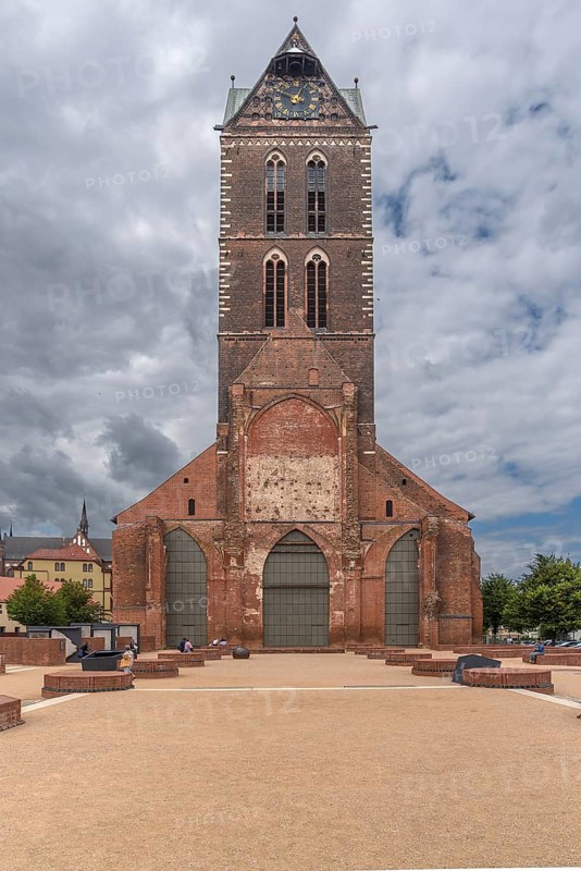 Remaining tower of St Mary's Church, built from 1260-70, in front the bases of the pillars of the former nave of the church, St Mary's Churchyard, Wismar, Mecklenburg-Western Pomerania, Germany, Europe
