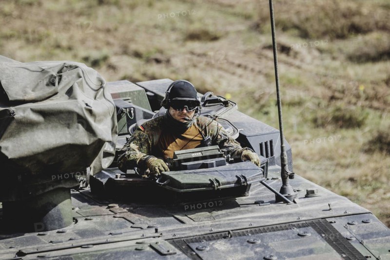A soldier in a Boxer armoured transport vehicle, photographed as part of a Bundeswehr exercise with armed forces from Norway and the Czech Republic during the 'Wettiner Schwert' exercise as part of Quadriga 2024 in the training town of Schnöggersburg, 8 April 2024