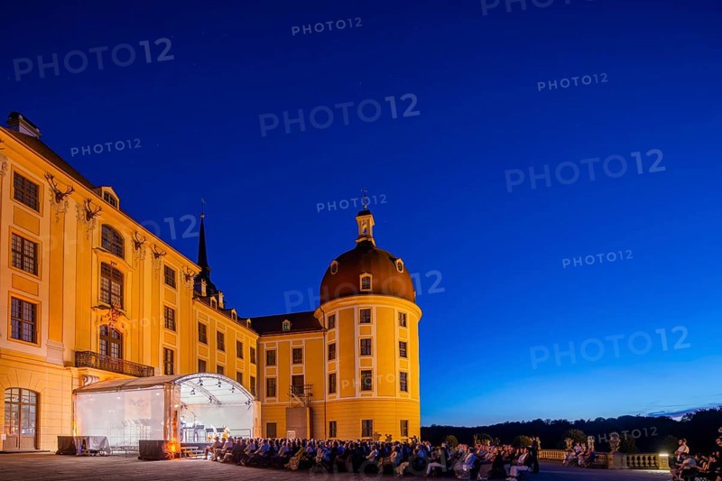 The Moritzburg Festival is an annual chamber music event in Saxony. It was founded in 1993 in Moritzburg by the soloists Kai Vogler, Peter Bruns and Jan Vogler. In Moritzburg, the artists find the ideal setting for the realisation of their musical dreams. The Moritzburg Festival, which has been under the sole artistic direction of cellist Jan Vogler since 2001, has long since established itself internationally as one of the most important festivals for chamber music thanks to its exceptional quality. Here is an evening concert on the north terrace of the baroque palace, Moritzburg Chamber Music Festival, Moritzburg, Saxony, Germany, Europe