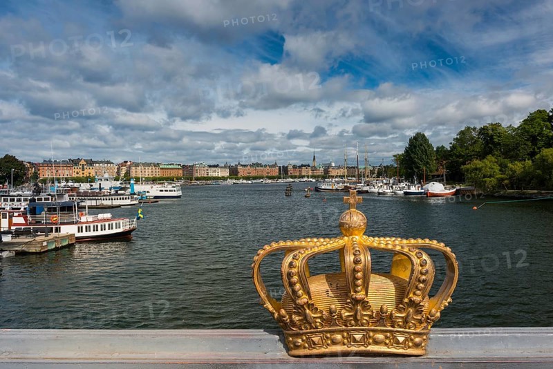The crown of Sweden on a bridge, capital, travel, centre, tourism, city centre, urban, city, city trip, historical, royal, monarchy, city view, Gamla Stan, Scandinavia, Stockholm, Sweden, Europe