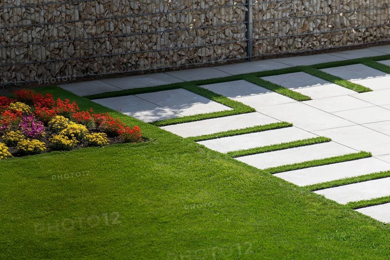 Beautiful stone terrace in a well-tended ornamental garden