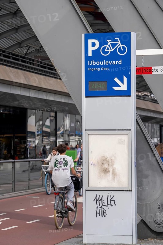 New bicycle car park at Amsterdam Central Station, IJboulevard, space for around 4000 bicycles, digitally monitored, single exit, underground, direct connection to the station, built into the water of the IJ, at the back of the station, Netherlands