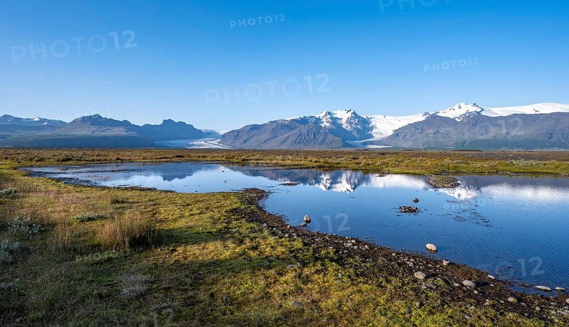 Lake with reflection, view of glacier tongues Skaftafellsjökull and Svínafellskökull, glaciated mountain peak Hrútfjallstindar and mountain Kristínartindar, Vatnajökull National Park, Austurland, Iceland, Europe