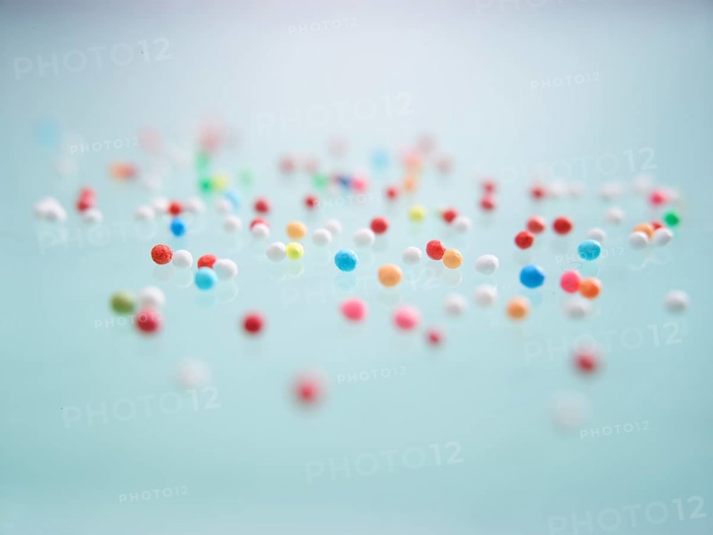 Colourful nonpareils, sugar pearls, sprinkle decorations in bright colours, mini sugar balls for decorating ice cream, cakes and muffins