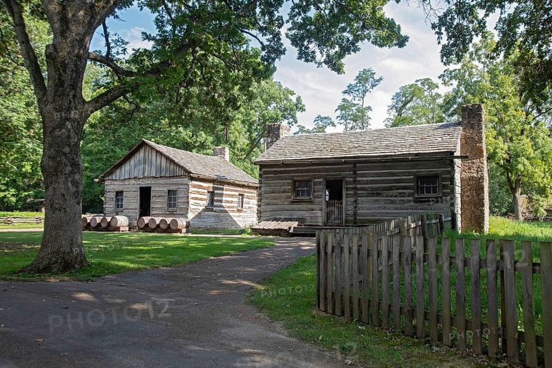Petersburg, Illinois - Henry Onstot's residence (right) and his cooper shop (where he made buckets, tubs, and barrels) at Lincoln's New Salem State Historic Site. The site is a reconstruction of New Salem Village, where Abraham Lincoln lived as a young man from 1831 to 1837. The reconstruction was done as a Civilian Conservation Corps project during the Great Depression.