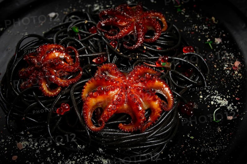 Black spaghetti with baby octopuses, homemade, no people