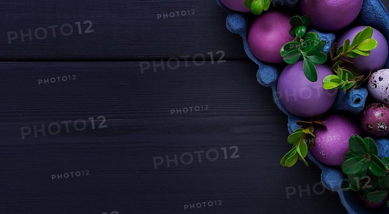 Easter eggs, purple and lilac, on a gray wooden table, Easter card, banner, selective focus, horizontal
