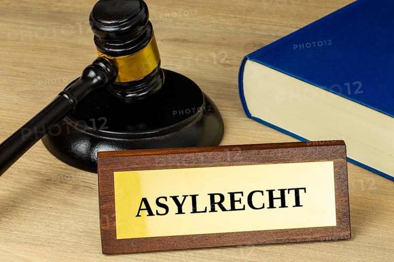 Symbol image of asylum law Germany : Close-up of a brass sign with the inscription ASYLRECHT (asylum law)