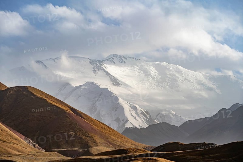 Dramatic mountain landscape, mountain valley, behind glaciated and snow-covered mountain peak Pik Lenin, Trans Alay Mountains, Pamir Mountains, Osh Province, Kyrgyzstan, Asia