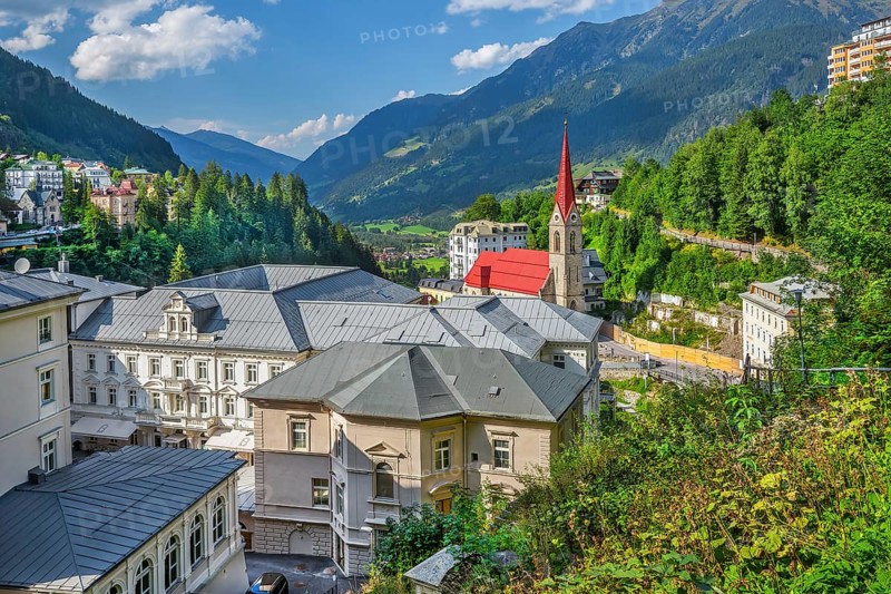 View of the village with Grandhotel Straubinger by the waterfall and parish church, Bad Gastein, Gastein Valley, Hohe Tauern, Pongau, Salzburg Province, Austria, Europe