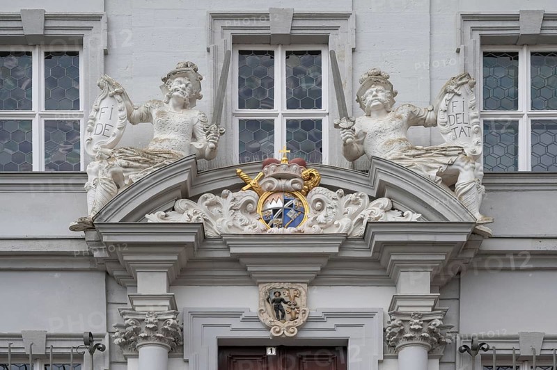 Entrance potal with sculptures and coat of arms of the baroque town hall, built in 1718, Iphofen, Lower Franconia, Bavaria, Germany, Europe