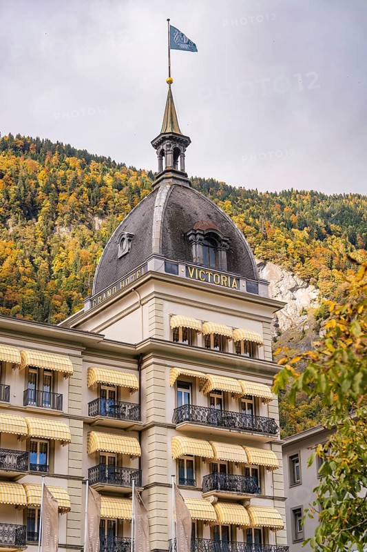 A luxurious hotel building in front of an autumnal mountain landscape, Lake Brienz, Interlaken, Switzerland, Europe