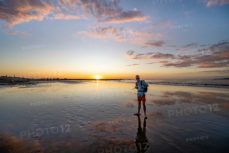 Evening mood, man at low tide on the beach, Marino Ballena National Park, Puntarenas Province, Osa, Costa Rica, Central America