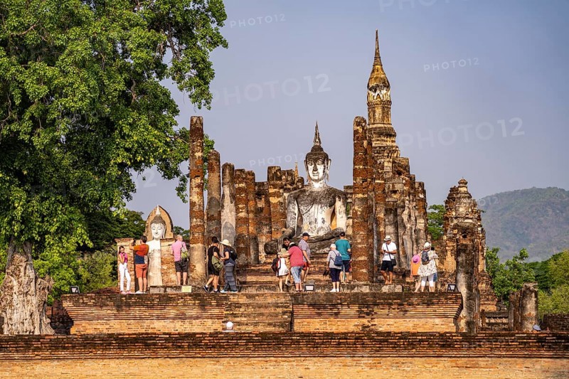 Tourists in the central Buddhist temple Wat Mahathat, UNESCO World Heritage Sukhothai Historical Park, Thailand, Asia