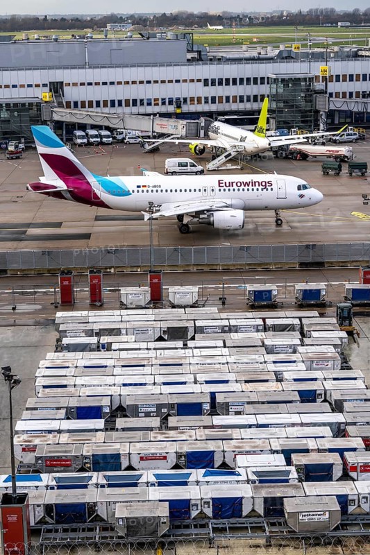 Düsseldorf Airport, Unit Load Devices, ULD, containers for baggage and freight for narrow-body and wide-body aircraft, baggage and freight are pre-packed in here and can then be quickly loaded or unloaded onto the aircraft, Eurowings, Air Baltic aircraft on the apron, at Terminal A, Düsseldorf, North Rhine-Westphalia, Germany, Europe