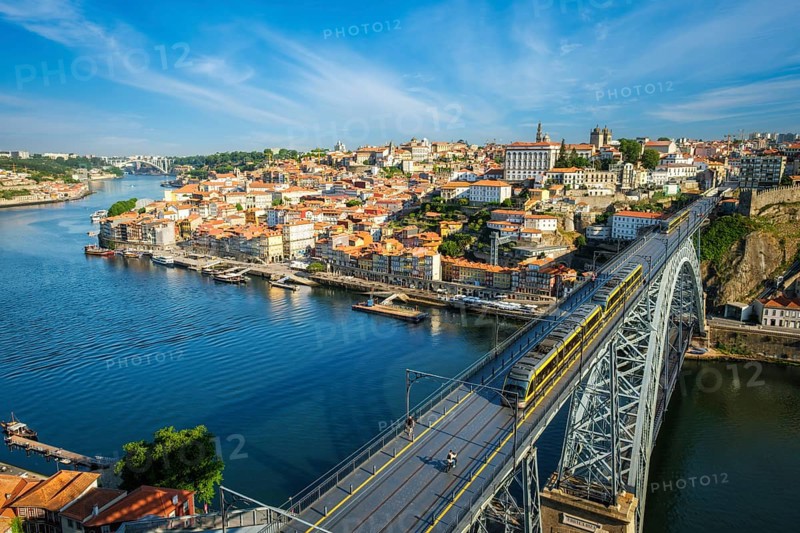 View of Porto city and Douro river and Dom Luis bridge I with metro tram from famous tourist viewpoint Miradouro da Serra do Pilar. Porto, Vila Nova de Gaia, Portugal, Europe