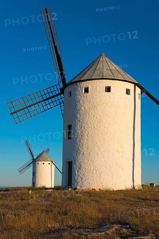 Large windmill in the sunlight with another one in the background, Campo de Criptana, Ciudad Real province, Castilla-La Mancha, Don Quixote Route, Spain, Europe