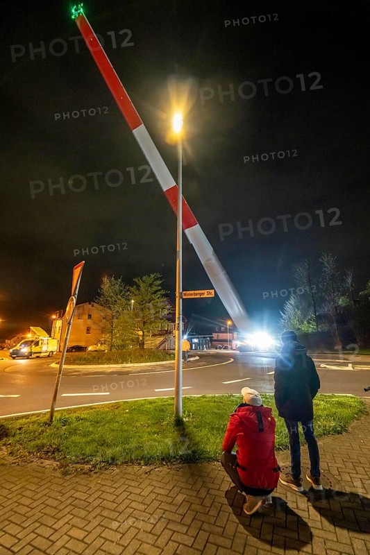 Transport of a 68 metre long, 22 tonne blade of a wind turbine, here in Schwelm, with a self-propelled Blade-Lifter vehicle, over a 40 km long route, over 2 nights, in the Bergisches Land, through towns, villages, over country roads, narrow through roads, to the construction site of the wind turbine near Hagen, North Rhine-Westphalia, Germany, Europe