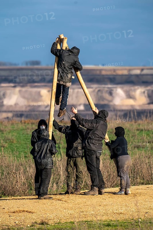Start of the eviction of the hamlet Lützerath at the lignite mine Garzweiler 2, activists try to obstruct the preparation for the upcoming eviction of the site, which is occupied by climate protection activists, the energy company RWE prepares the construction of work roads, protected by the police, North Rhine-Westphalia, Germany, Europe