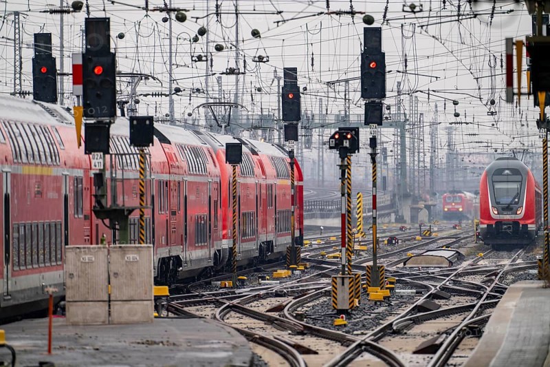 Railway tracks with regional trains, after freezing rain, in front of Frankfurt main station, skyline in the fog, Hesse, Germany, Europe