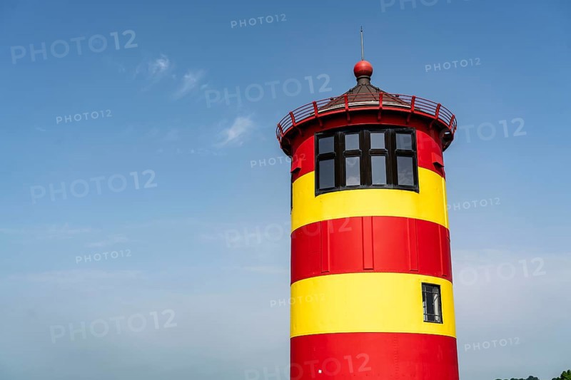The Pilsum lighthouse on the North Sea dyke near Greetsiel, East Frisia, Lower Saxony, Germany, Europe
