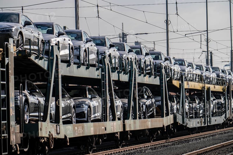 Car train, goods train on its way to the car terminal in Bremerhaven seaport, new German cars for export overseas, Bremerhaven, Bremen, Germany, Europe