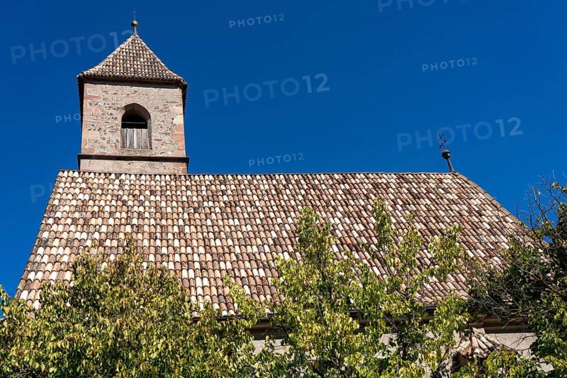 Church in the village of Montiggl, colourful shingle roof, on the South Tyrolean Wine Road, near the village of Kaltern, Italy, Europe