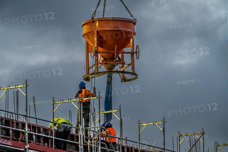 Concrete work, at dusk, on a large construction site building a residential and commercial complex, North Rhine-Westphalia, Germany, Europe