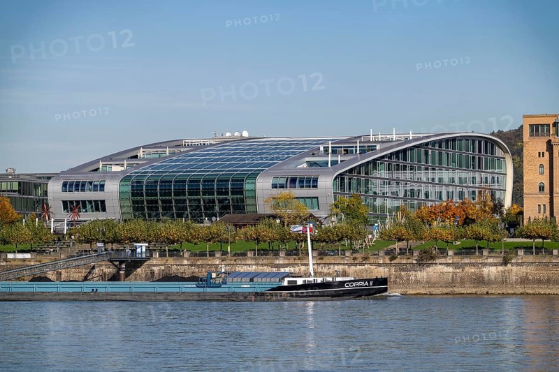 The Kameha Grand Hotel in Bonn, directly on the Rhine, Bonn-Beuel, cargo ship, North Rhine-Westphalia, Germany, Europe