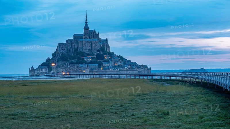 Mont Saint Michel in front of sunrise, rocky monastery island in the Wadden Sea, Le Mont Saint Michel, Normandy, France, Europe