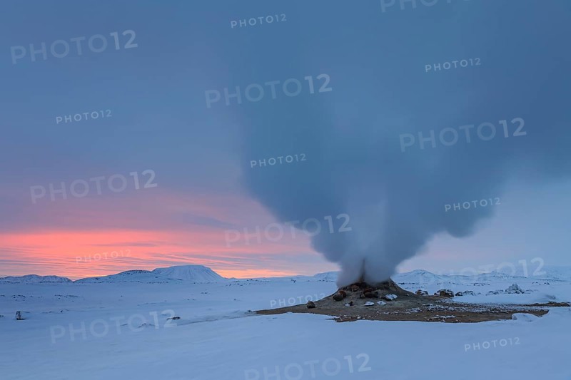 Hot springs and geothermal area in front of a mountain landscape in winter, cloudy mood, Hverir, Namafjall, Myvatn, Iceland, Europe