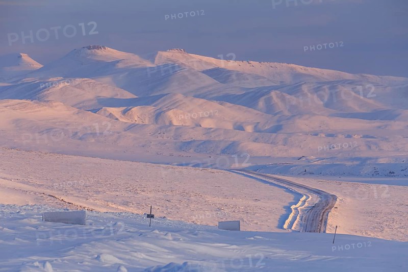 Road, gravel road, highway, icy, snowy, mountain landscape, morning light, Dempster Highway, Northwest Territories, Canada, North America