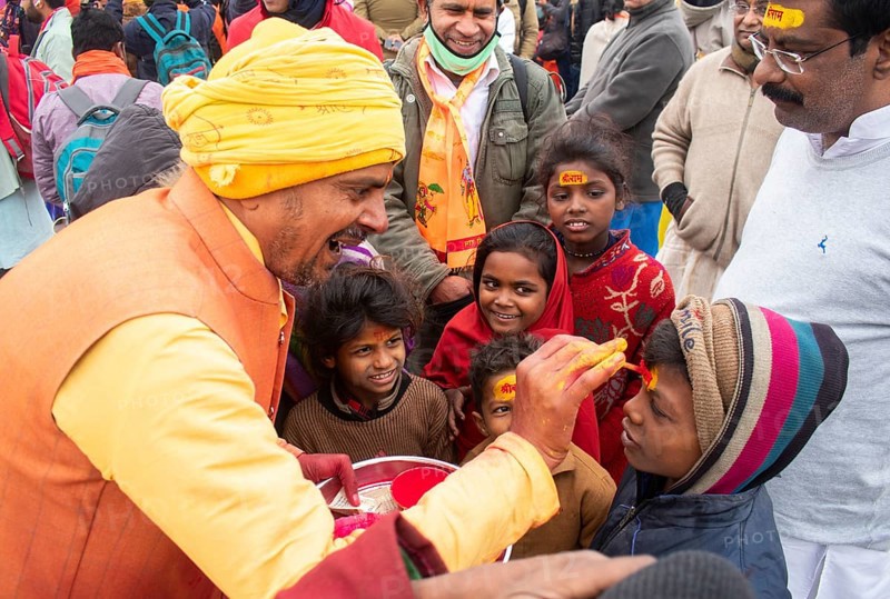 Children get painted the name of Lord Ram on their forehead, on the eve of consecration ceremony of the Ram temple, in Ayodhya, Uttar Pradesh, India on 22 January 2024