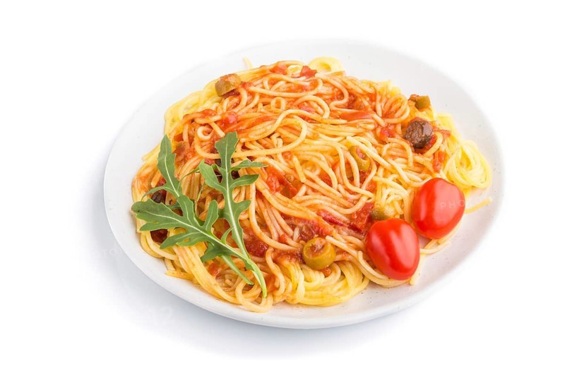 Corn noodles with tomato sauce and arugula isolated on white background. Side view, close up