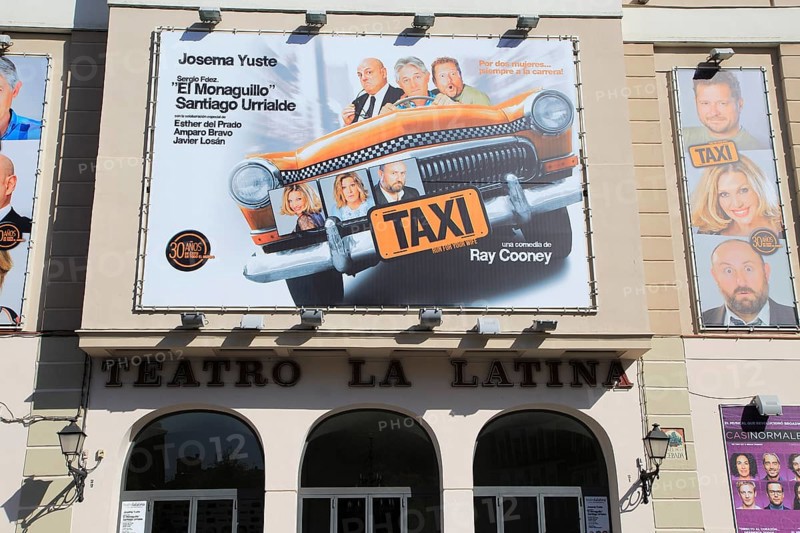 Taxi poster billboard advert, Teatro la Latina theatre playhouse, Madrid city centre, Spain, Europe