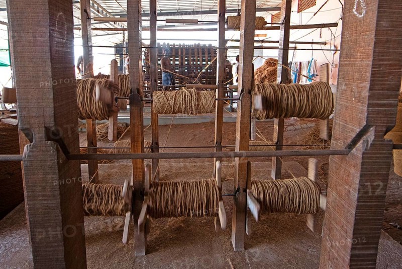 Coir fibre bobbins in the spinning mill of the Labourers Coir Mats and Mattings Cooperation, coir mat production, Muhamma, Alappuzha, Kerala, India, Asia