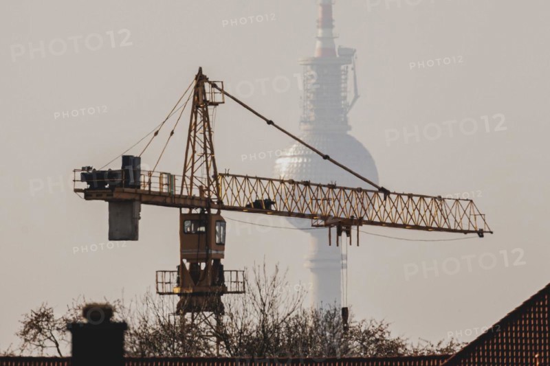 A crane looms in front of the Berlin television tower in Berlin, 29/02/2024