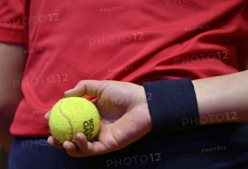 Tennis ball in the hand of a ball girl, back, logo, Roland-Garros, tennis, Porsche Cup 2024, Porsche Arena, Stuttgart, Baden-Württemberg, Germany, Europe