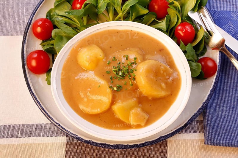 Swabian cuisine, sour potato wheels, potato slices in sour sauce, healthy cuisine, typical Swabian, home cooking, traditional cuisine, food photography, studio