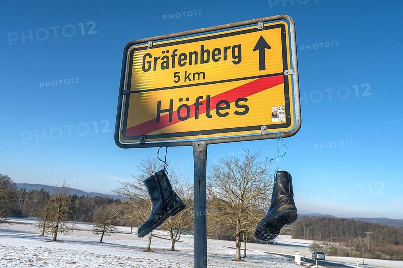 Rubber boots on the town sign: Silent protests by Bavarian farmers, Höfles, Upper Franconia, Bavaria, Germany, Europe
