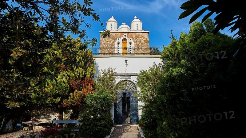 Church with white domes framed by trees and blue sky, Koroni, Byzantine fortress, nunnery, Peloponnese, Greece, Europe